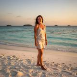 Olena Kovalenko on a sandbank in the Maldives at sunset